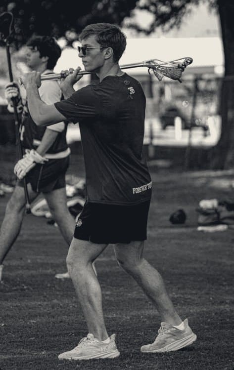 Ashtin Reich mid-drill with a lacrosse stick at practice.